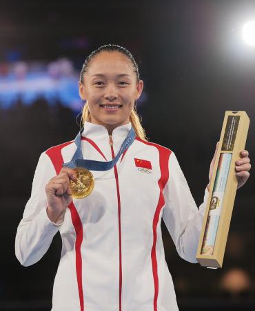 Team China punches to historic gold