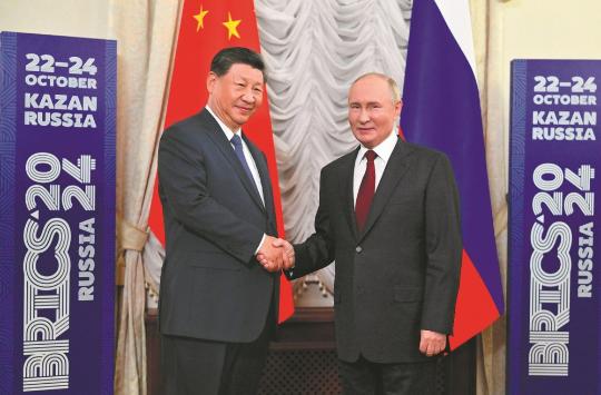 Xi, Putin meet ahead of BRICS summit