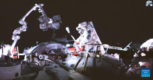 Crew floats for 8 hours in its first spacewalk