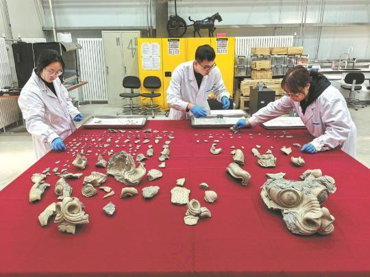 Clay dragon heads, glass beads help connect dots in history