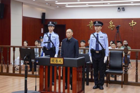 Former official sentenced for bribery, insider trading