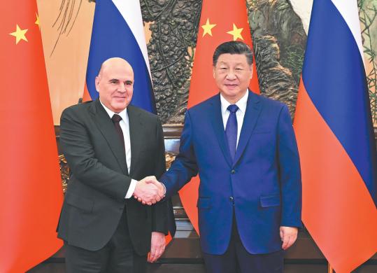 Xi calls for better synergy with Russia