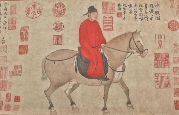 A painting on display shows a man riding a horse by Yuan Dynasty (1271-1368) artist Zhao Mengfu. (Photo: Jiang Dong/ China Daily)